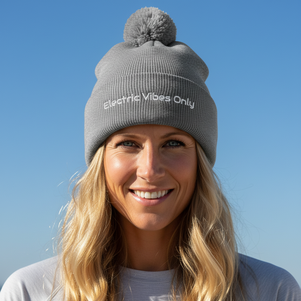  Women wearing a heather grey pom pom  Electric Vibes Only beanie - lifestyle shot.