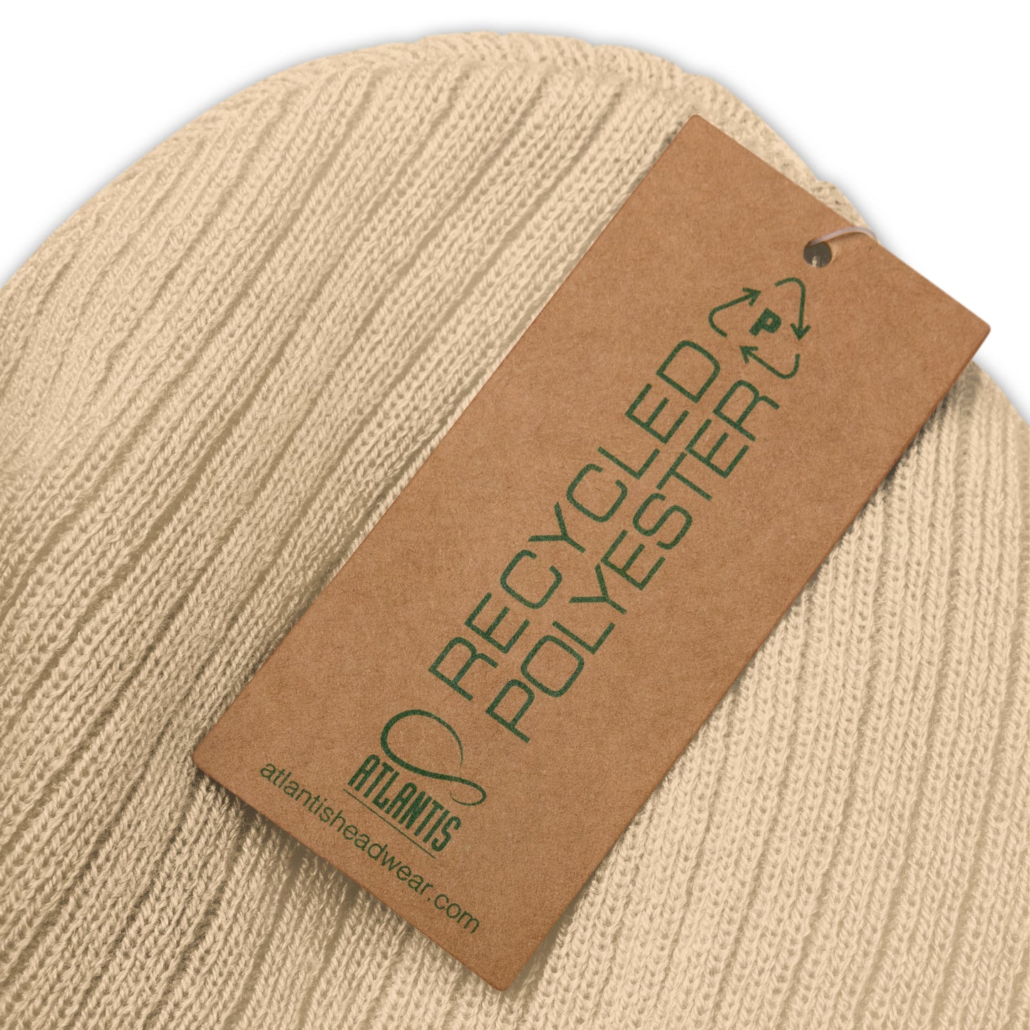 Beige beanie with a recycled polyester tag on a beige background